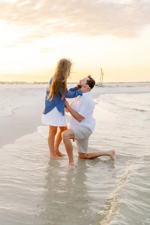 Giffen proposal, kneeling in the surf at sunset, Dauphin Island