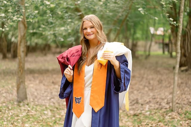 Hudson senior portraits in graduation gown, Pensacola