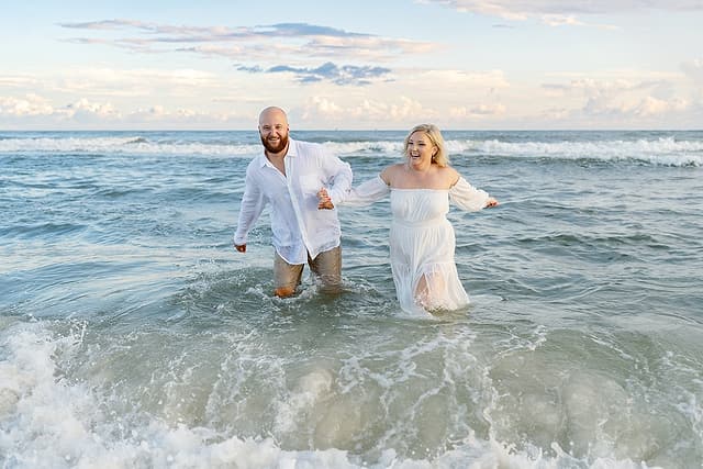Ryan engagement, walking through the waves at Fort Morgan